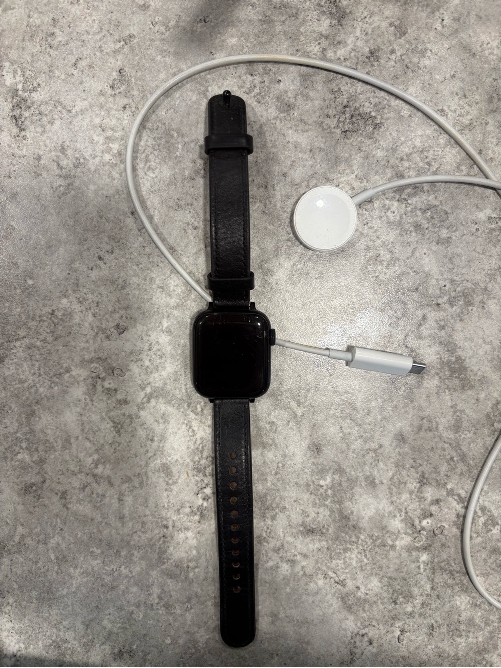 Black Smartwatch with Leather Band and Magnetic Charger